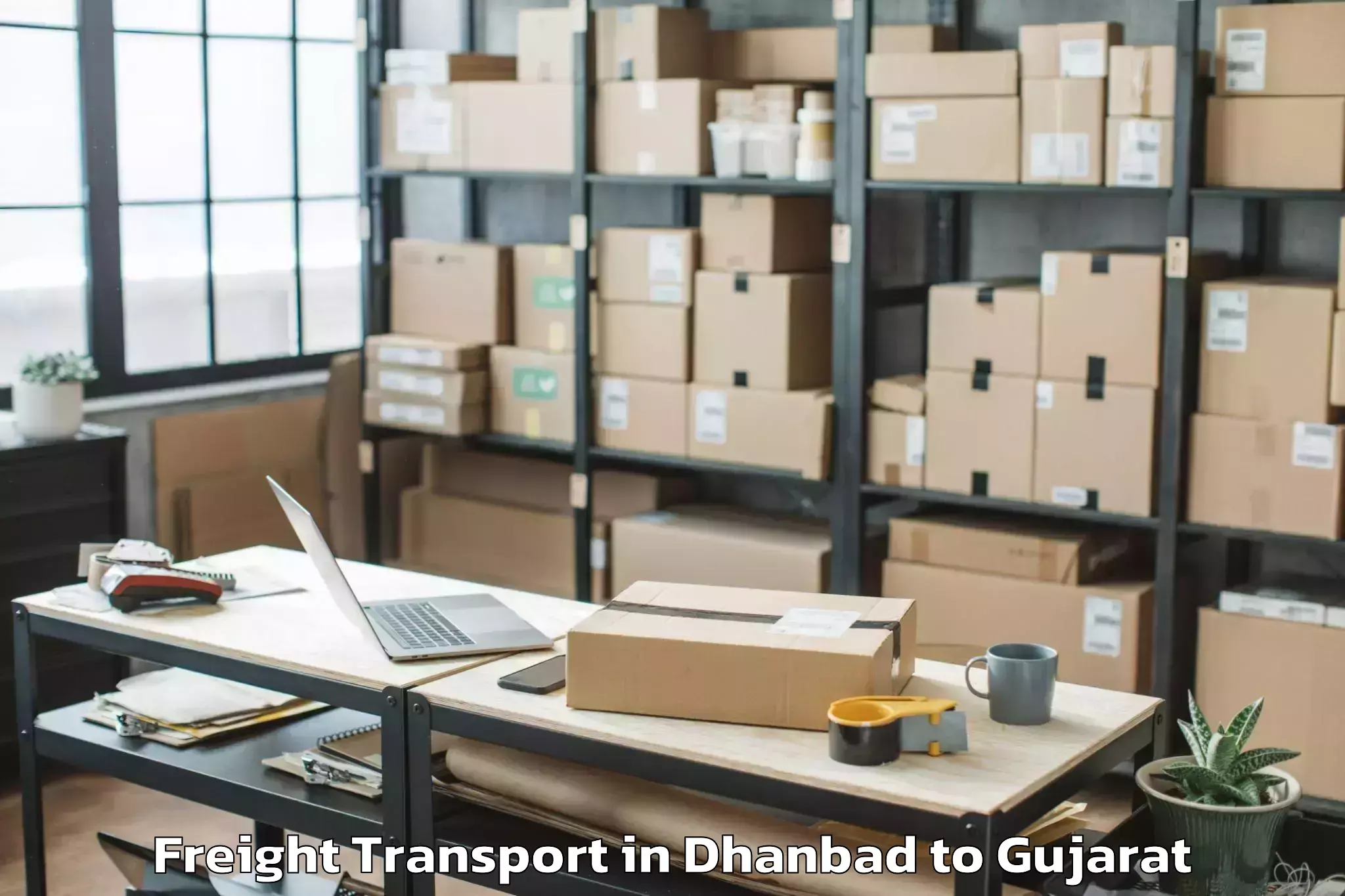 Leading Dhanbad to Gujarat University Of Transpla Freight Transport Provider